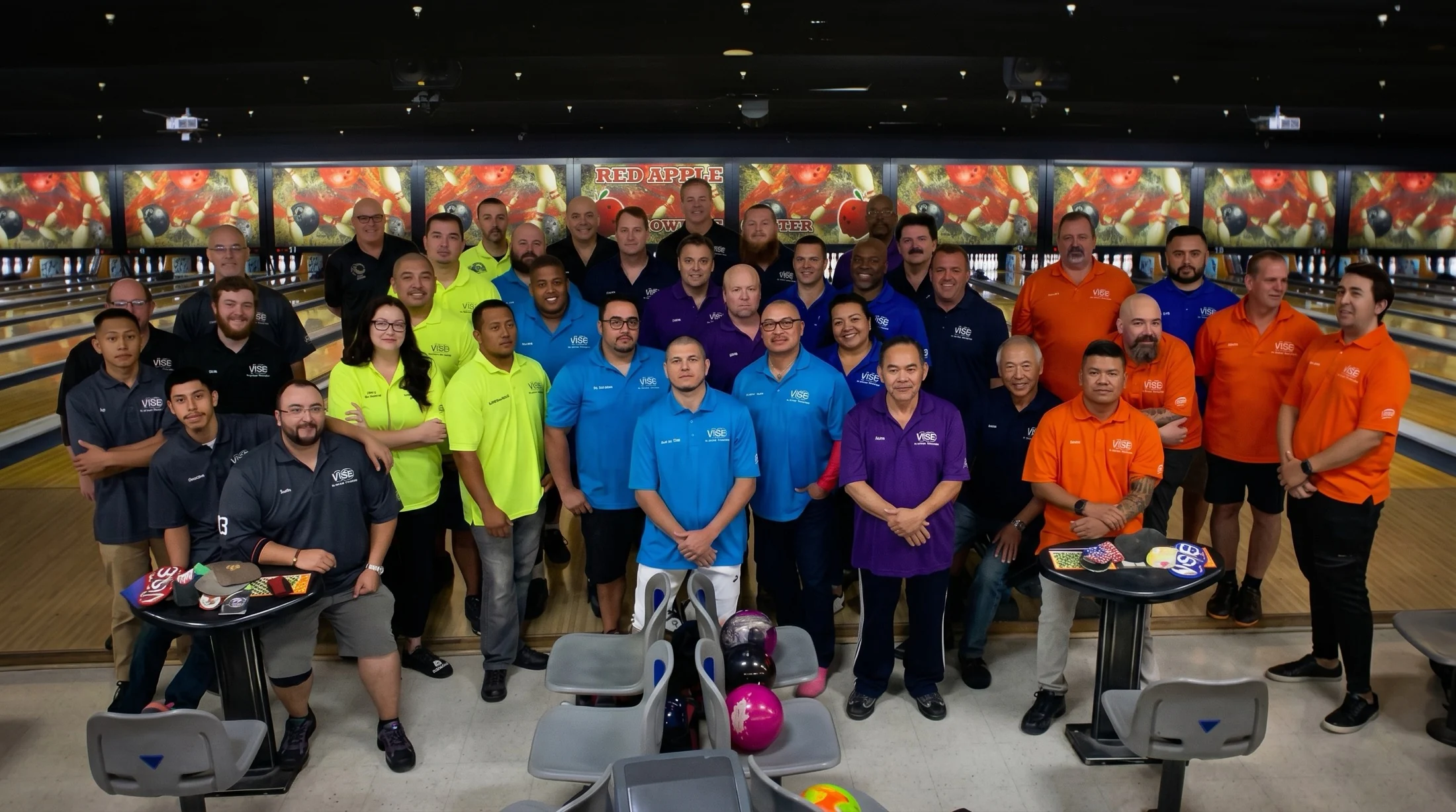 The full Merchants League gathered together at the Red Apple lanes in colorful VISE team shirts